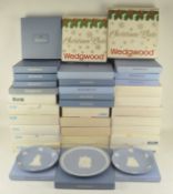 A large collection of Wedgwood Christmas plates, most being boxed,