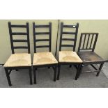 A set of three modern black painted ladder back chairs with rush seats, 104cm high,