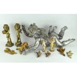 A collection of various cherub/putti figures and a pair of lamp bases,