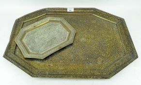 A large embossed and inlaid Middle Eastern tray, together with a smaller example,