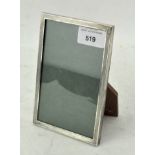 A vintage silver mounted photo frame, adorned with engine turned decoration,