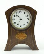 A French mahogany mantle clock, with platform escapement, with oval inlaid marquetry ,