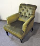 A Victorian green velvet upholstered button back armchair,