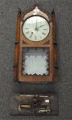 An American wall clock, oak cased,