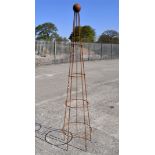 A large garden metal obelisk,