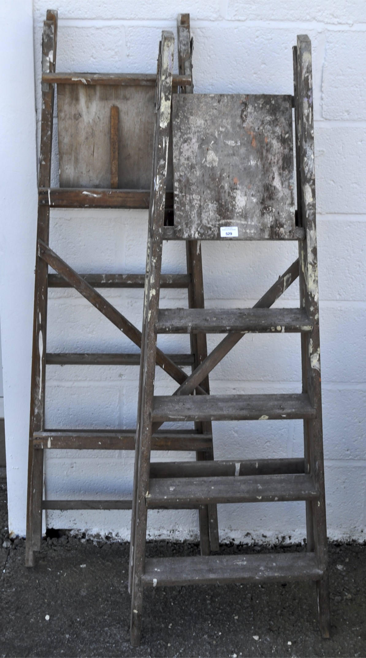 Two pairs of wooden step ladders,