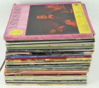 A collection of 12" LP vinyl records,