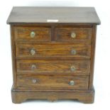 An early 20th century apprentice piece chest of drawers, with two short over three long drawers,