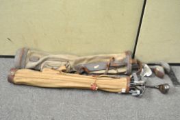 Two vintage golf bags with golf clubs,
