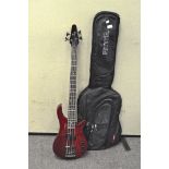 A Ganglewood Rebel 4K electric guitar in red, in soft Ritter case,