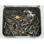 A large selection of watch winding keys of various sizes