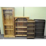 A pair of contemporary adjustable pine bookcases and two small 20th century oak bookcases,