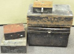 A collection of five metal and wooden storage trunks,