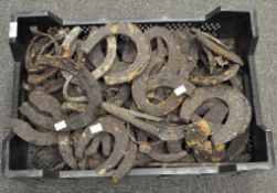 A large collection of horseshoes, including early examples,