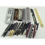 A collection of vintage pens, mostly fountain,