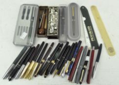 A collection of vintage pens, mostly fountain,