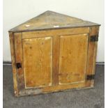 A pine corner cabinet,