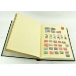 A stamp album containing various Polish stamps,