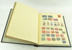 A stamp album containing various Polish stamps,