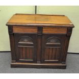 A late 19th century oak two door cupboard,