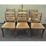 A set of six dining chairs with upholstered seats,