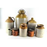 A collection of brown saltglaze stoneware flagons and storage jars in sizes, 20th century,