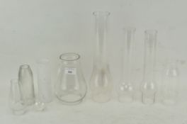 Ten clear and frosted glass oil lamp chimneys,