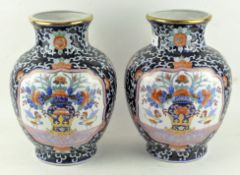 A pair of large Chinese vases decorated with polychrome enamels, four character marks to base,