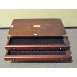 A 20th century wood and brass-mounted cutlery box, with carry handles and three graduated drawers,