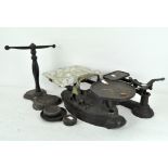 A set of early 20th century kitchen scales with weights, together with two other sets of scales,