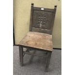 An oak carved chair, early 20th century, with carved square back,