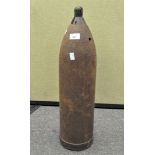 A large military artillery shell,