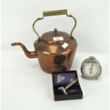 A copper kettle, alarm clock and a razor