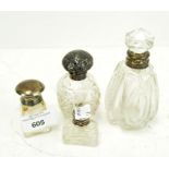 Four silver mounted glass scent bottles,
