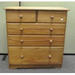 A modern pine chest of drawers, two short and three long drawers,