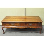 A two drawer mahogany effect coffee table,