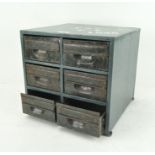A six drawer tabletop metal storage cabinet,