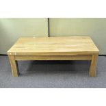 A modern oak coffee table of rectangular form,