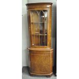 A Regency style mahogany floor standing corner cupboard,