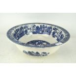 A large blue and white Willow pattern wash bowl by Wedgwood,