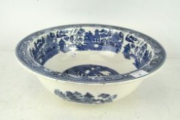 A large blue and white Willow pattern wash bowl by Wedgwood,