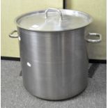 A large twin handled metal cooking pot,