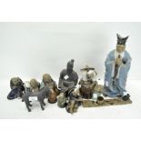A collection of Chinese figures, including part glazed and biscuit buddhistic figures,