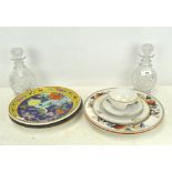 Two cut glass decanters, of squat form, 21cm high, together with a selection of ceramic plates,