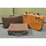 Three vintage carry cases, including a briefcase,