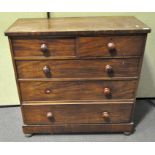 A Victorian mahogany chest of drawers, with two short and three graduated long drawers,