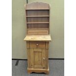 A pine bedside cabinet, short drawer over a single cupboard door, 66cm high,