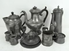 A large collection of assorted pewter, to include a chamber stick, tea pots,