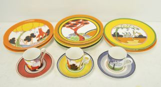 A selection of modern Clarice Cliff style plates and coffee cans by Wedgwood,