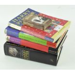 Four Harry Potter books, comprising: a softback 'The Philosopher's Stone',